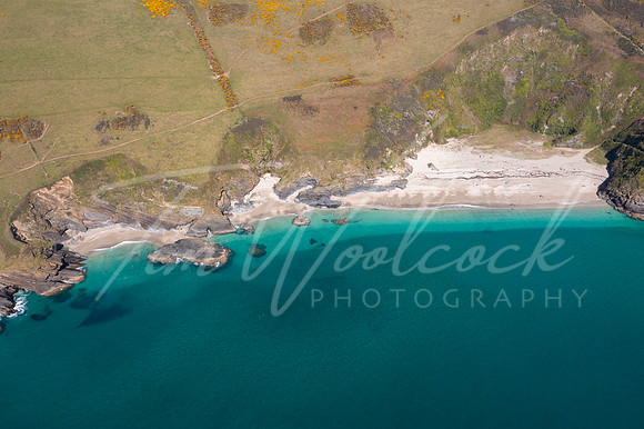 aerial photograph of Lantic Bay, Cornwall, England.
